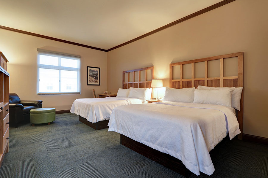 guest room with two quee beds